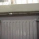 AIB sheet above radiator to protect wooden shelf from heat