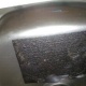 Bitumen pad or acoustic dampener to underside of stainless steel sink