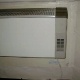 Cement sheet between wall and heater